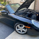A towel is required to keep the hood from latching while the battery is disconnected.